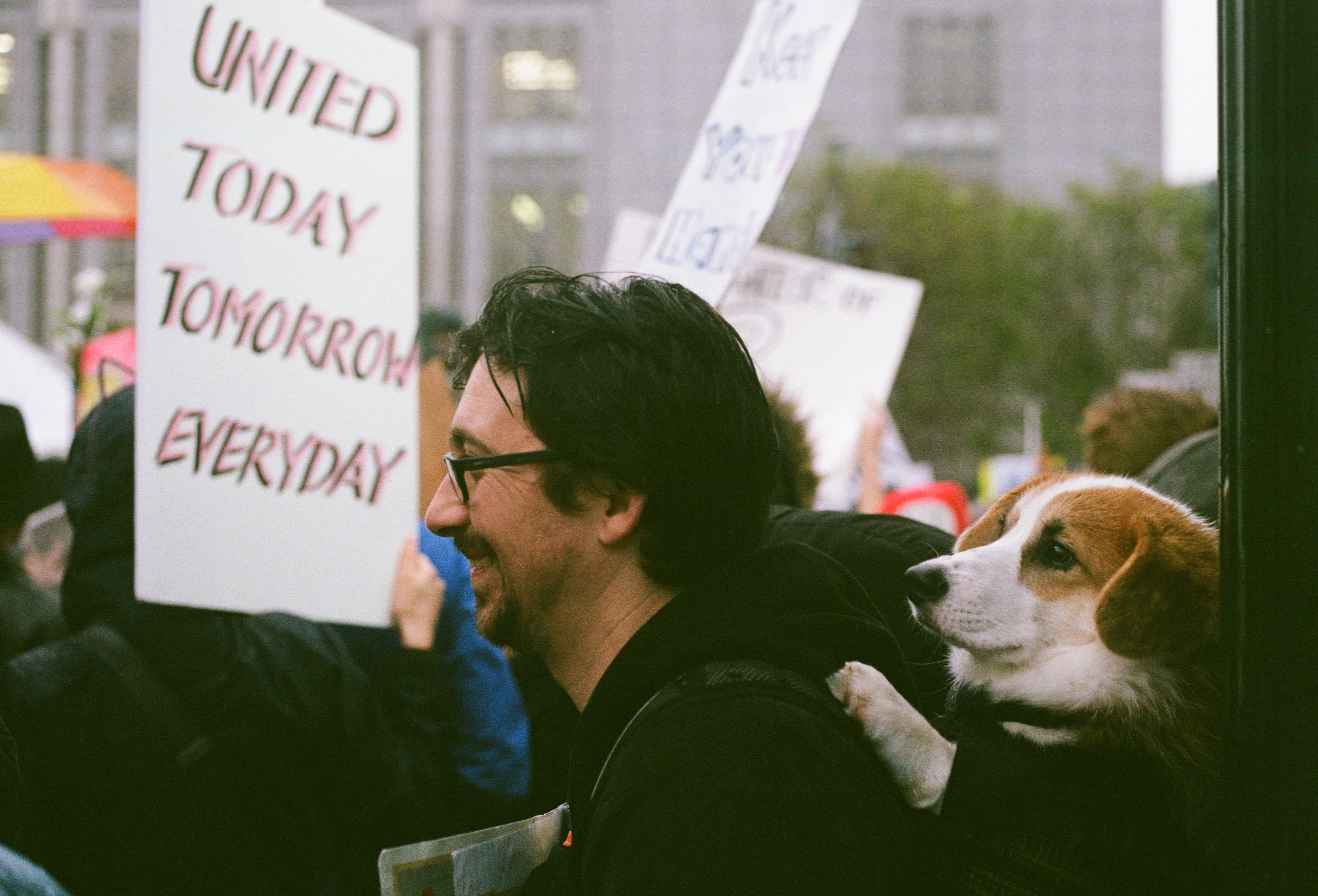 A man and his dog take part of the 1st Women's March in San Francisco.