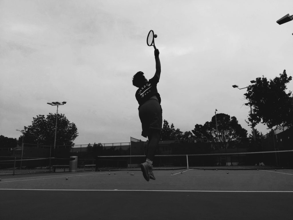 Photo of the rule of thirds that shows motion. The photo shows a boy(me) serving the ball.