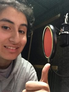 An image of me doing a thumbs up in front of the mic