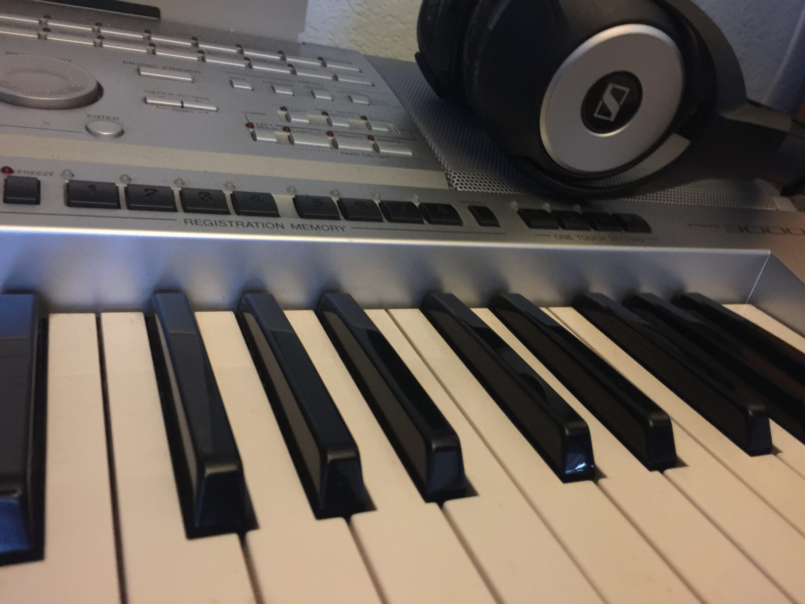A piano keyboard and headphones