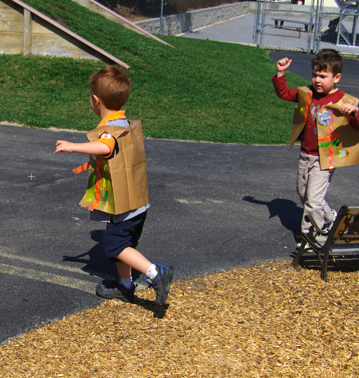remy and ryan playing with paper bags