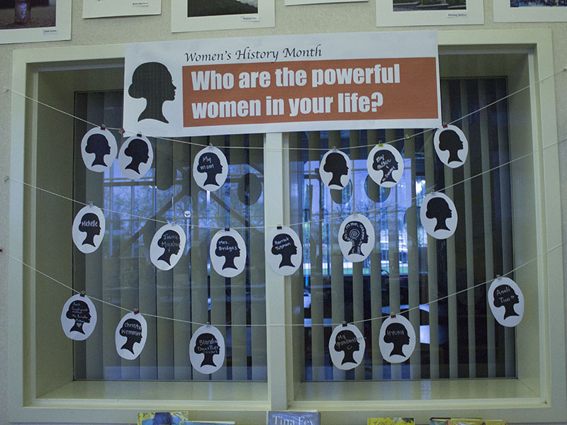 A setup prompting kids to write about prominent women in their life for Women's History Month at the Los Altos High School Library.