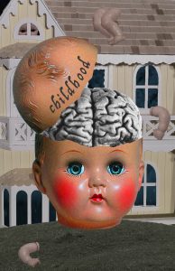 An image of a heavily saturated babydoll's head with a brain coming out of it. In the background there is an under-saturated dollhouse with babydoll limbs scattered on it. There is a lawn under the babydoll head and there is a dark blue background coming through the windows of the dollhouse.