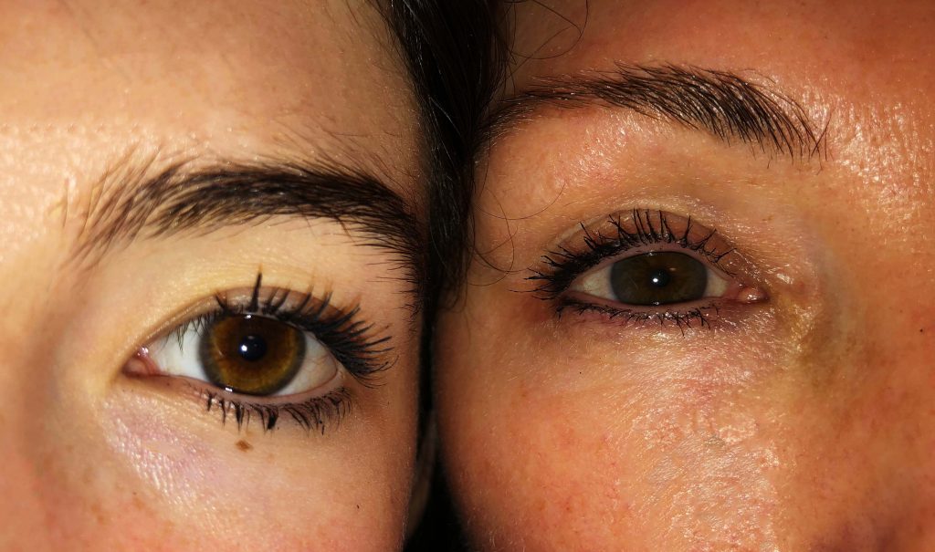 Image of a childs eye aligned with an adult eye zoomed in 