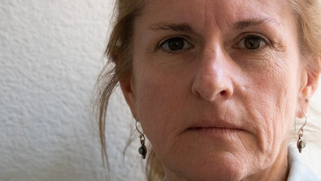 A closeup picture of my mother with white space. 