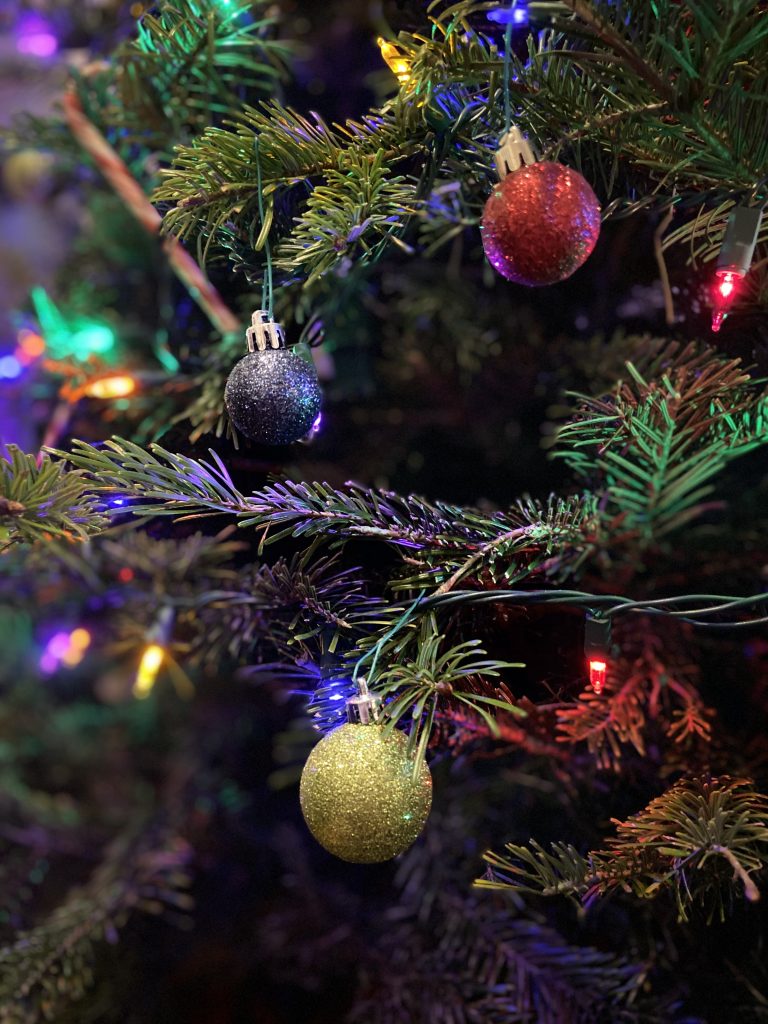 A collection of 3 xmas ornaments on a tree