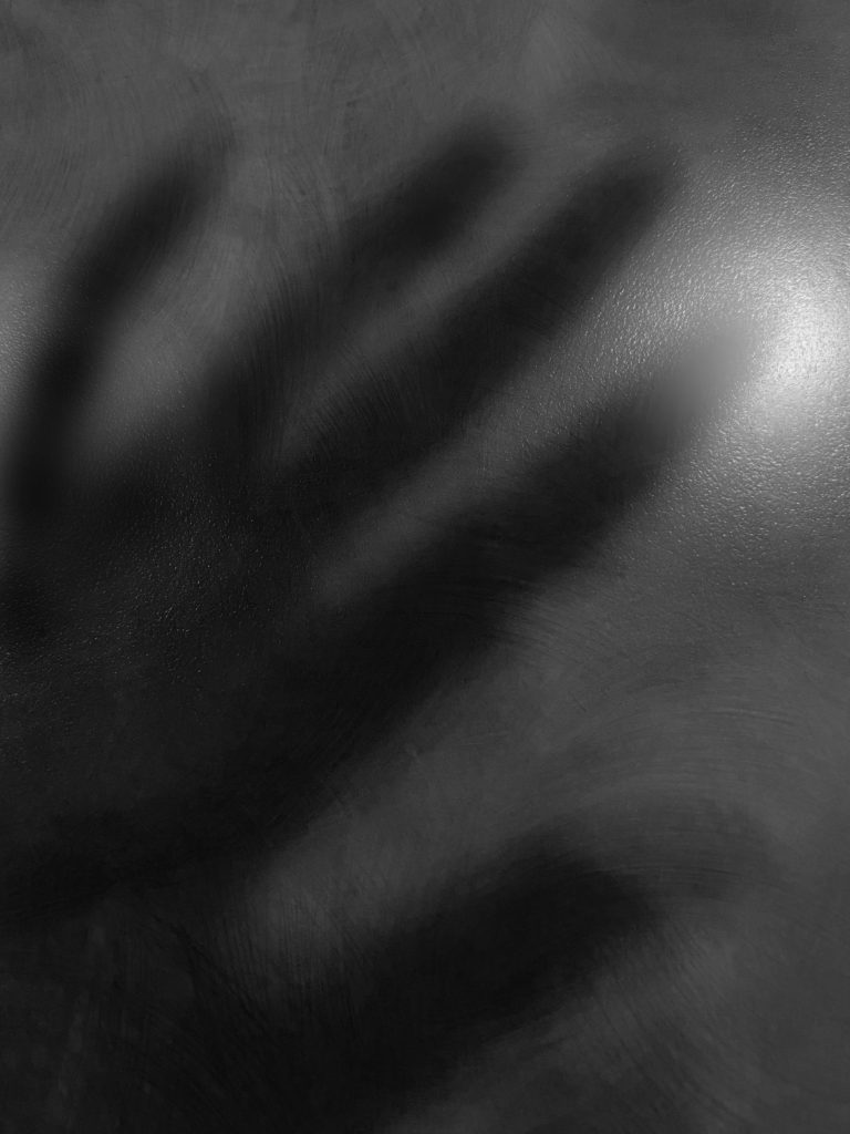 a shadow picture of a hand in black and white