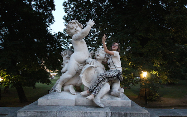 Posing with sculptures