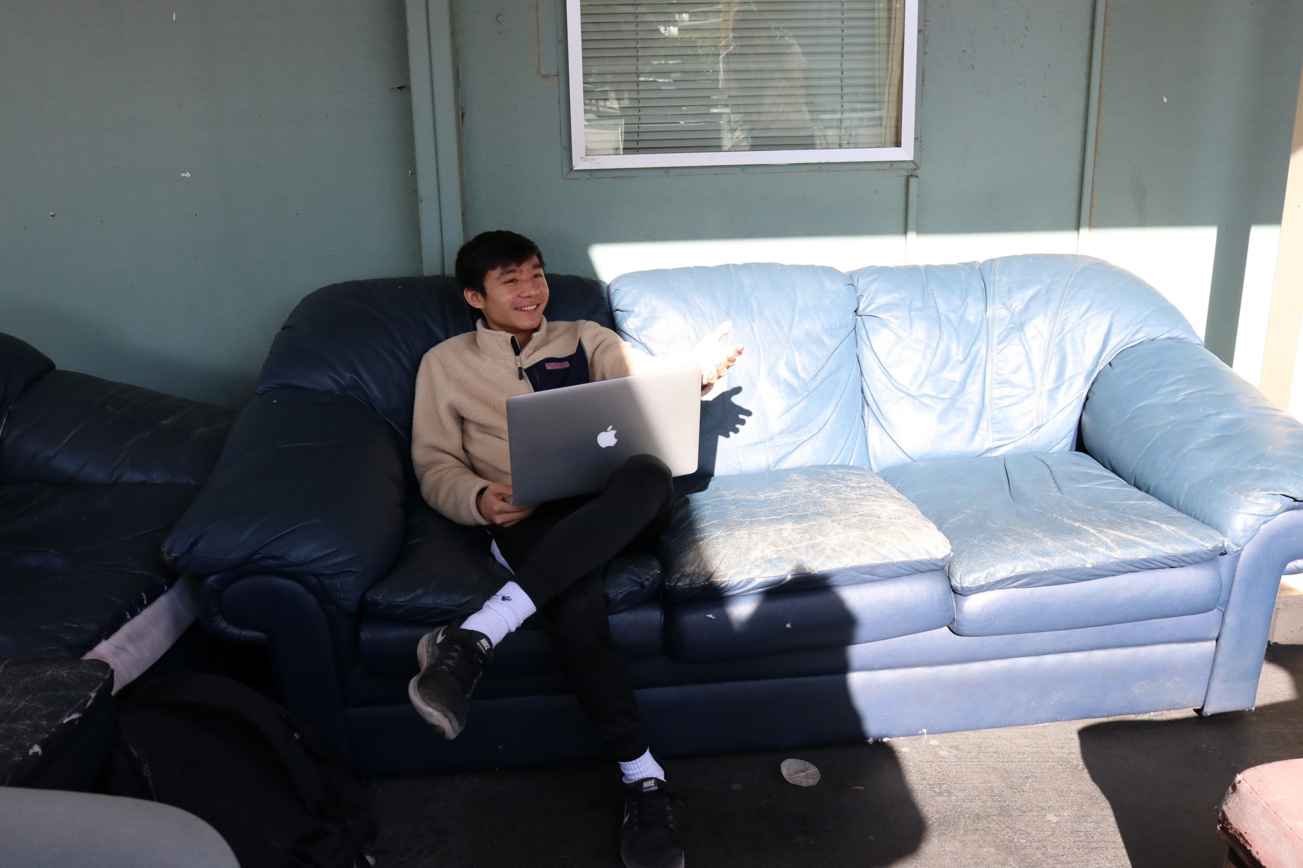 There are three couch pillows in this photo