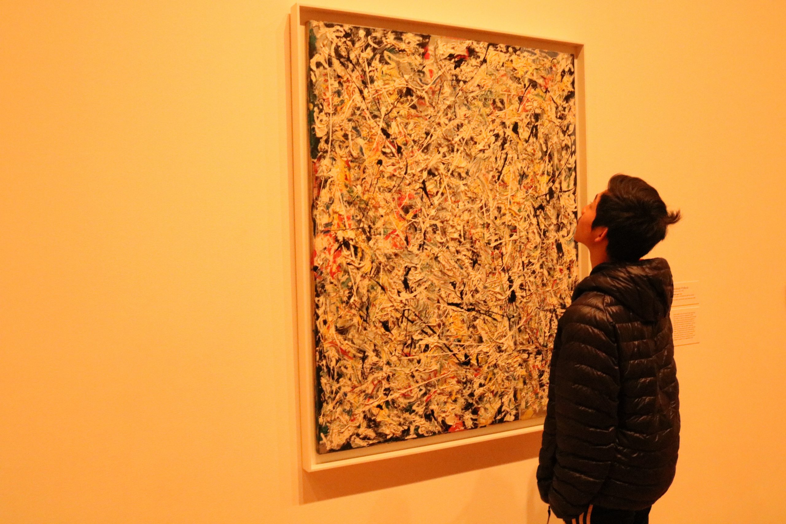 My little bro looking at a messy painting