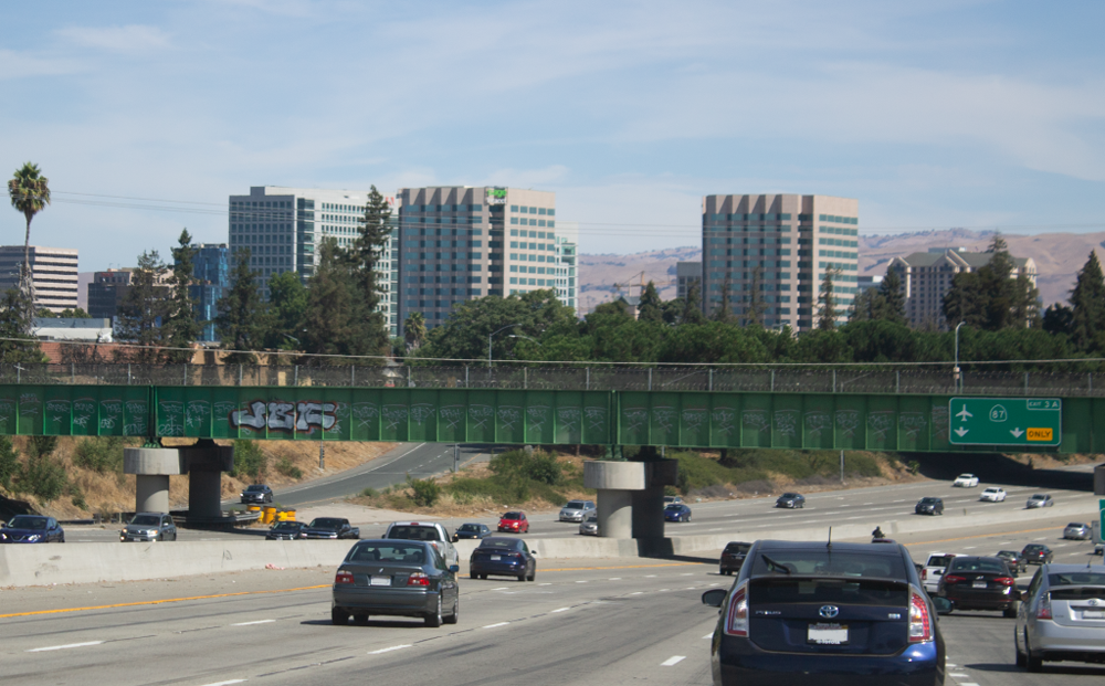 Shot of three similar looking buildings in a row off of the highway.