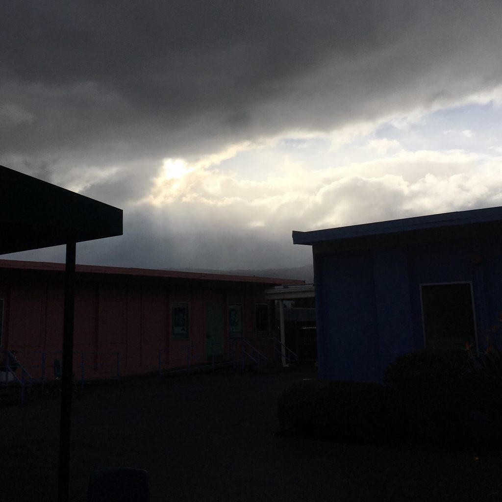 A picture of light beaming down from gloomy rain clouds after a shower. Take on Freestyle Campus.