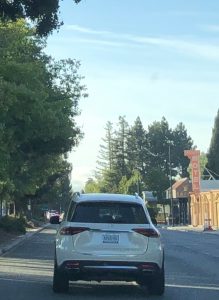 Photo of the rules of thirds that shows motion. The photo shows a car driving on a street. 
