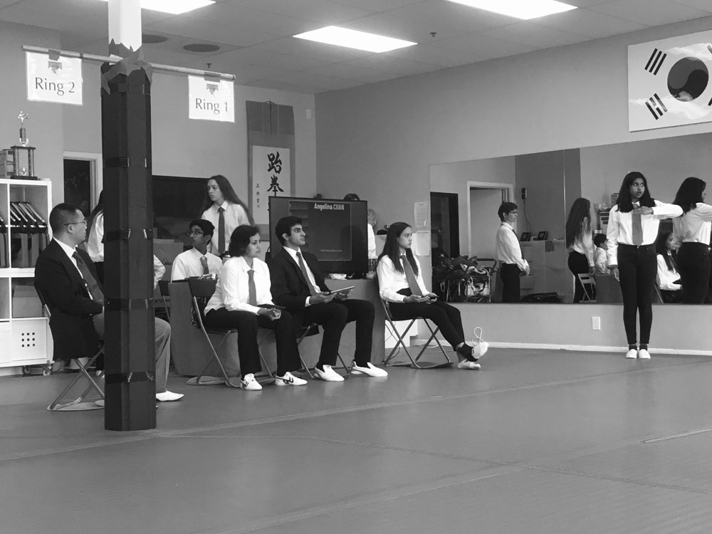 Image of a Martial Artis studio with several people.