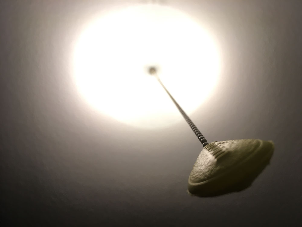 Photo of ceiling with an overhead light.