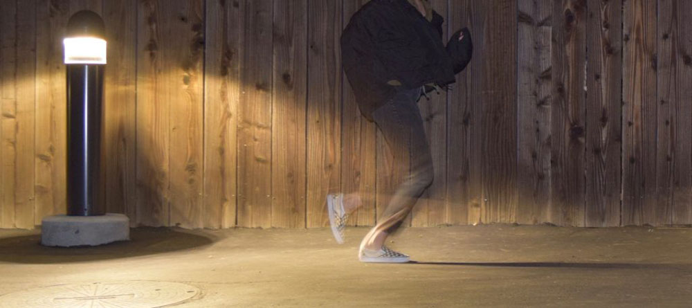 This is a photo of a person running with low exposure of the movement of the feet. Giving a blurry effect.