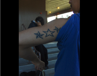 Elvis arm tattoo