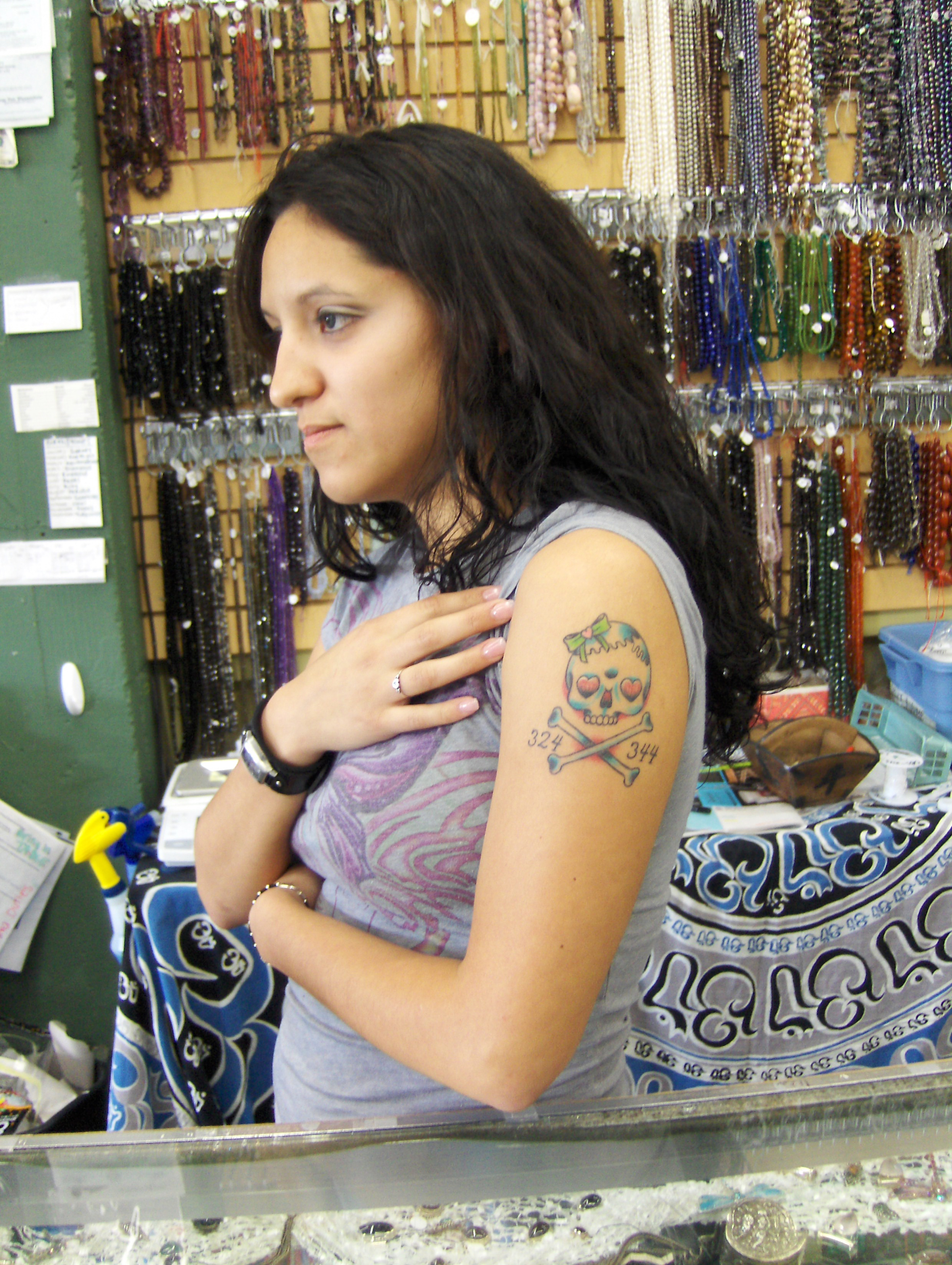 A skull tattoo on Venesa B's arm