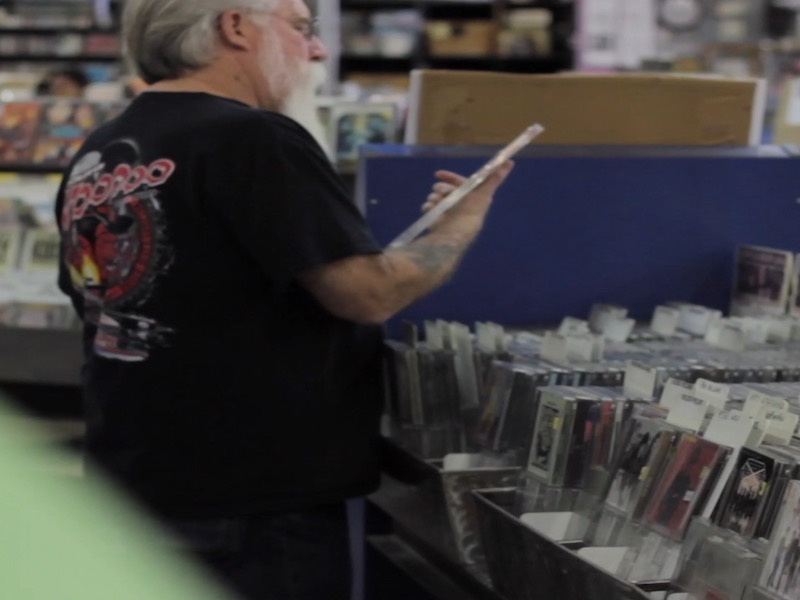 A Man Browsing CDs