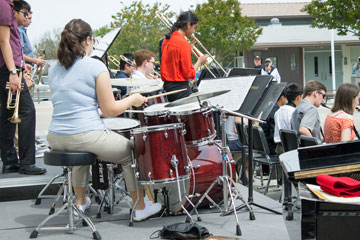 Isabella playing drum set in the Jazz Band