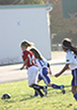 Mandy chases after the soccer ball during a soccer game against the Palo Alto Blue team.