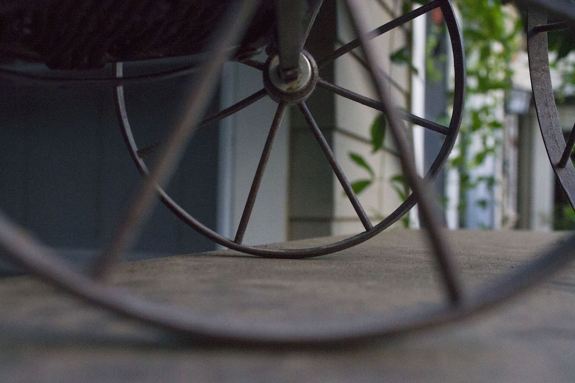 This is a photo of a wheel from an antique tricycle I have in my house.